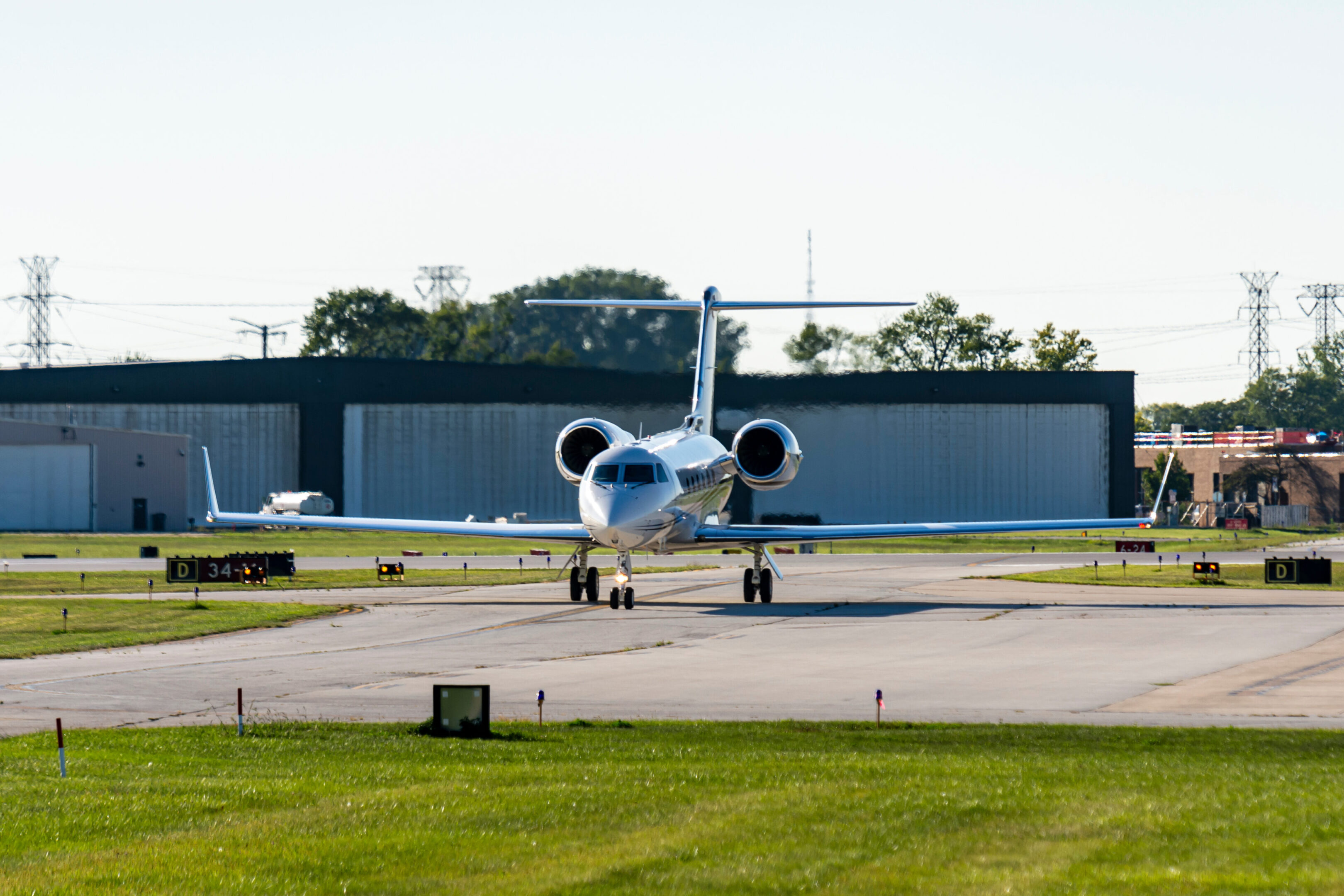 A large white airplane sitting on top of an airport runway.